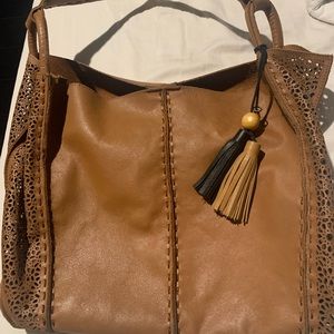 The Sak genuine leather handbag. Very spacious and soft leather, like brand new